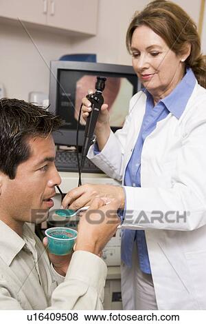 Doctor Performing Check-Up On Patient View Large Photo Image Stock Photo - Doctor Performing Check-Up On Patient. Fotosearch