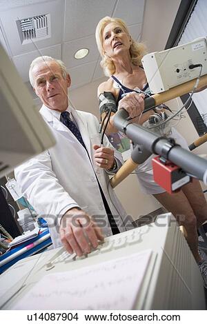 Picture - Doctor With Patient During Health Check. Fotosearch