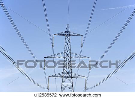 Electricity Pylons Against A Blue Sky View Large Photo Image Stock Image - Electricity Pylons Against A Blue Sky. Fotosearch