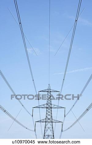Electricity Pylons Against A Blue Sky View Large Photo Image Stock Photography - Electricity Pylons Against A Blue Sky. Fotosearch