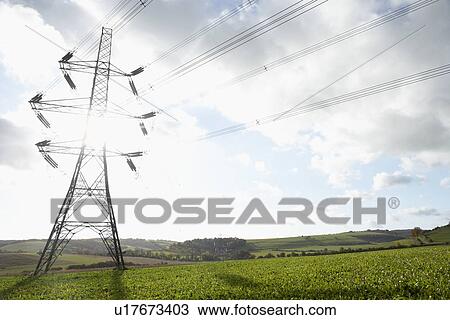 Stock Image - Electricity Pylons In A Paddock. Fotosearch