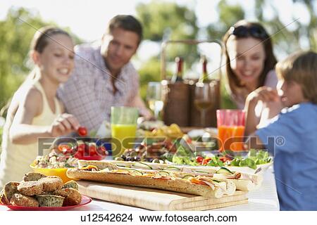 Family Dining Al Fresco View Large Photo Image Picture - Family Dining Al Fresco. Fotosearch