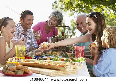 Picture - Family Dining Al Fresco. Fotosearch