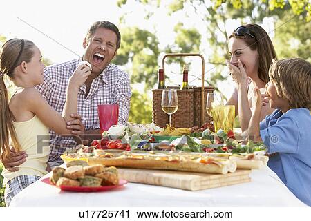 Stock Image - Family Dining Al Fresco. Fotosearch