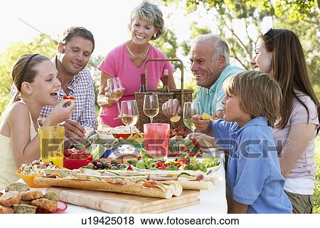 Stock Photo - Family Dining Al Fresco. Fotosearch