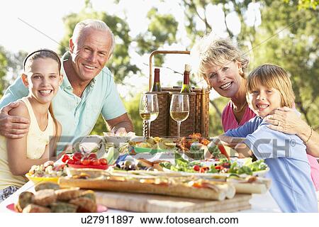 Stock Photo - Family Dining Al Fresco. Fotosearch
