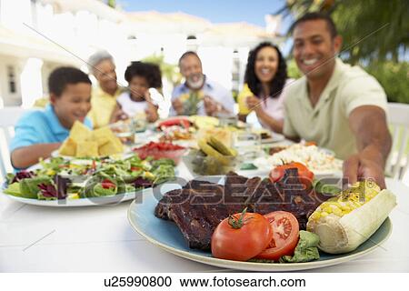 Family Eating An Al Fresco Meal View Large Photo Image Stock Image - Family Eating An Al Fresco Meal. Fotosearch