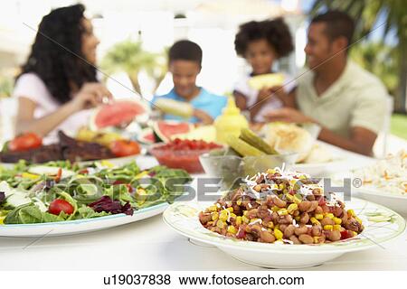 Family Eating An Al Fresco Meal View Large Photo Image Stock Photo - Family Eating An Al Fresco Meal. Fotosearch