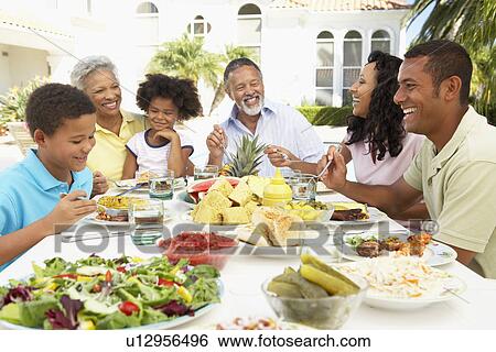 Family Eating An Al Fresco Meal View Large Photo Image Stock Photograph - Family Eating An Al Fresco Meal. Fotosearch
