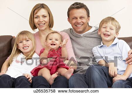 Stock Photo - Family Group On Sofa. Fotosearch