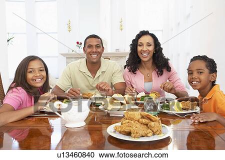 Family Having A Meal Together At Home View Large Photo Image Stock Image - Family Having A Meal Together At Home. Fotosearch
