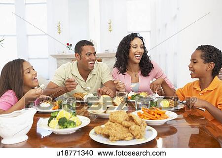 Family Having A Meal Together At Home View Large Photo Image Stock Image - Family Having A Meal Together At Home. Fotosearch
