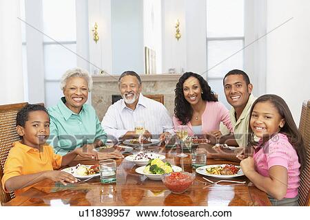 Stock Photo - Family Having A Meal Together At Home. Fotosearch