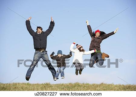 Stock Photo - Family Jumping In The Air. Fotosearch