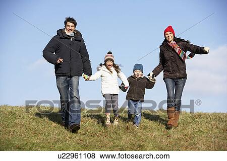 Stock Photo - Family Running In The Park. Fotosearch