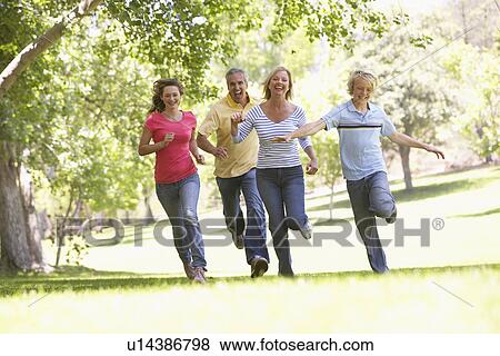 Family Running Through A Park View Large Photo Image Stock Photo - Family Running Through A Park. Fotosearch