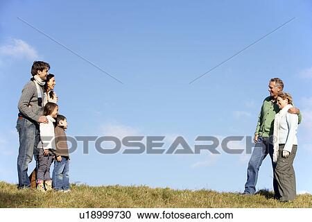 Family Standing In The Park View Large Photo Image Stock Image - Family Standing In The Park. Fotosearch