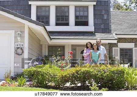 Stock Photo - Family Standing Outside House. Fotosearch