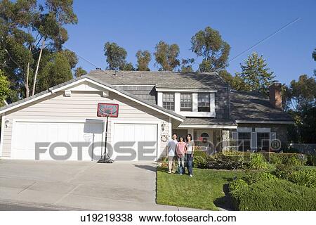 Family Standing Outside House View Large Photo Image Stock Photo - Family Standing Outside House. Fotosearch