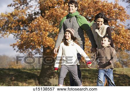 Family Walking In Park View Large Photo Image Stock Photo - Family Walking In Park. Fotosearch