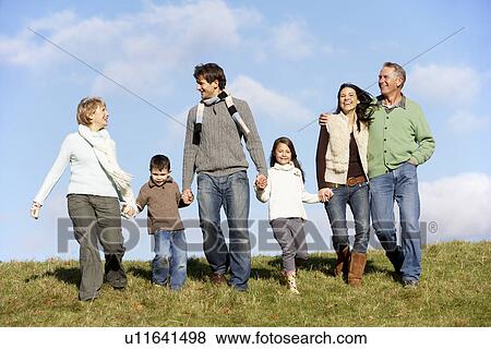 Family Walking In The Park View Large Photo Image Stock Photo - Family Walking In The Park. Fotosearch