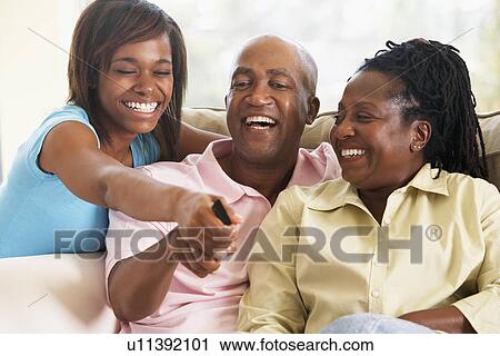 Stock Image - Family Watching Television Together. Fotosearch