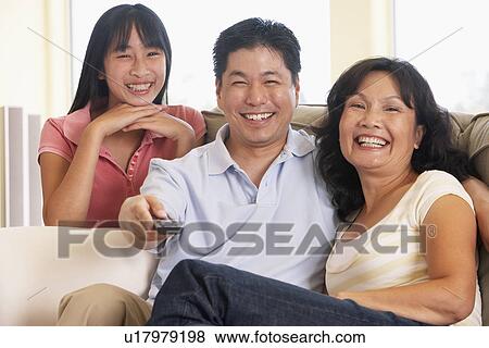 Stock Photo - Family Watching Television Together. Fotosearch