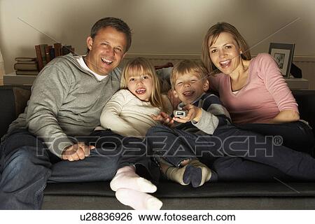 Stock Photograph - Family Watching Television Together. Fotosearch