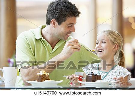 Father And Daughter Having Lunch Together At The Mall View Large Photo Image Stock Image - Father And Daughter Having Lunch Together At The Mall. Fotosearch