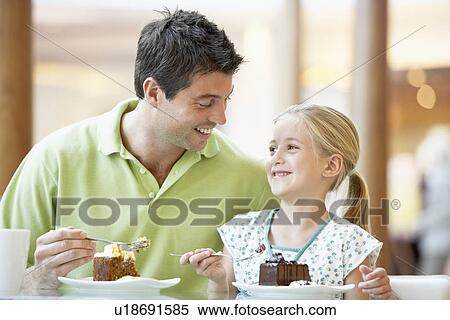 Stock Photography - Father And Daughter Having Lunch Together At The Mall. Fotosearch