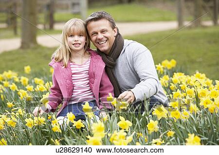 Father And Daughter In Daffodils View Large Photo Image Stock Image - Father And Daughter In Daffodils. Fotosearch