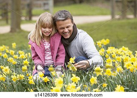 Father And Daughter In Daffodils View Large Photo Image Stock Photo - Father And Daughter In Daffodils. Fotosearch
