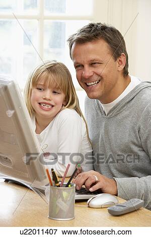 Father And Daughter Using Computer View Large Photo Image Stock Photo - Father And Daughter Using Computer. Fotosearch
