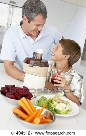 Father And Son Making Fresh Vegetable Juice View Large Photo Image Stock Photo - Father And Son Making Fresh Vegetable Juice. Fotosearch