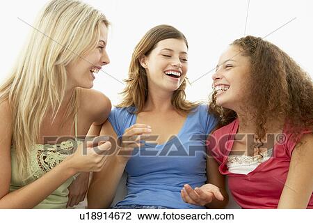 Stock Image - Female Friends Laughing Together. Fotosearch