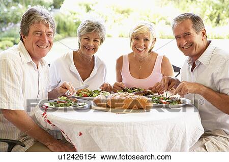 Friends Eating An Al Fresco Lunch View Large Photo Image Picture - Friends Eating An Al Fresco Lunch. Fotosearch