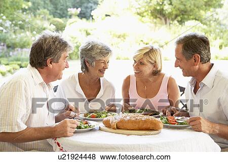 Stock Photo - Friends Eating An Al Fresco Lunch. Fotosearch