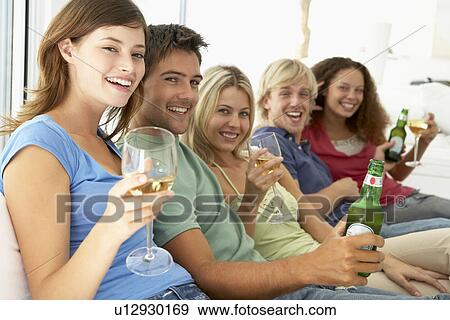 Stock Photo - Friends Enjoying A Drink Together. Fotosearch