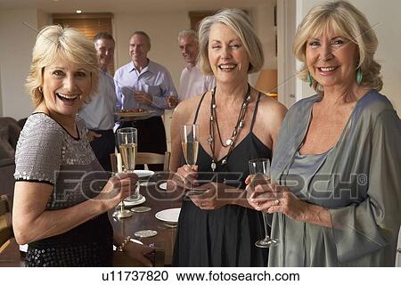 Friends Enjoying A Glass Of Champagne At A Dinner Party View Large Photo Image Stock Image - Friends Enjoying A Glass Of Champagne At A Dinner Party. Fotosearch