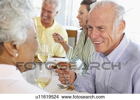 Friends Having Lunch Together At A Restaurant View Large Photo Image Picture - Friends Having Lunch Together At A Restaurant. Fotosearch