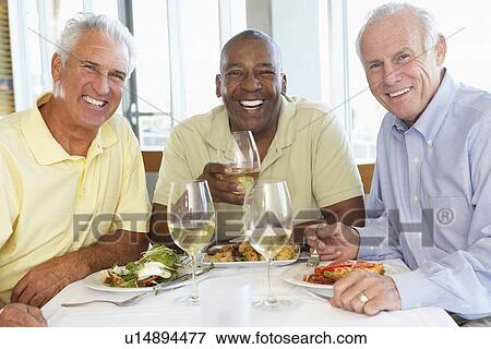Friends Having Lunch Together At A Restaurant View Large Photo Image Stock Photo - Friends Having Lunch Together At A Restaurant. Fotosearch