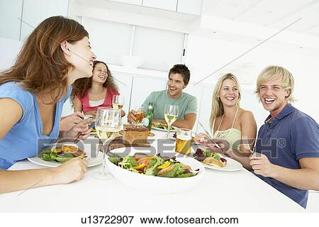 Friends Having Lunch Together At Home View Large Photo Image Stock Photo - Friends Having Lunch Together At Home. Fotosearch