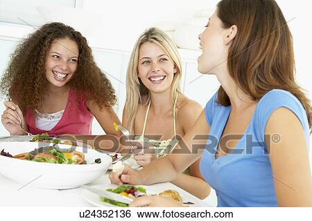 Friends Having Lunch Together At Home View Large Photo Image Stock Photograph - Friends Having Lunch Together At Home. Fotosearch