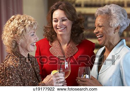 Friends Socializing At A Bar View Large Photo Image Stock Image - Friends Socializing At A Bar. Fotosearch