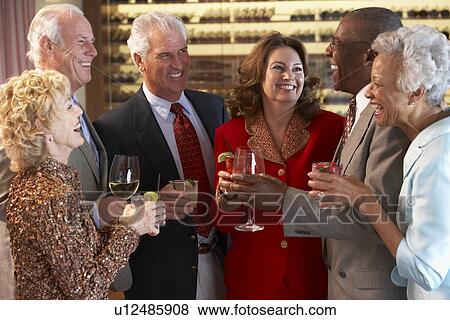 Friends Socializing At A Bar View Large Photo Image Stock Photo - Friends Socializing At A Bar. Fotosearch