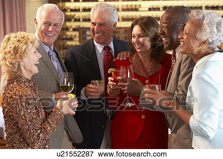 Friends Socializing At A Bar View Large Photo Image Stock Photo - Friends Socializing At A Bar. Fotosearch