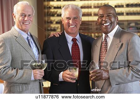 Stock Photograph - Friends Socializing At A Bar. Fotosearch