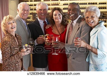 Stock Photograph - Friends Socializing At A Bar. Fotosearch
