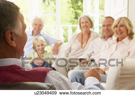 Stock Photo - Friends Socializing At Home. Fotosearch