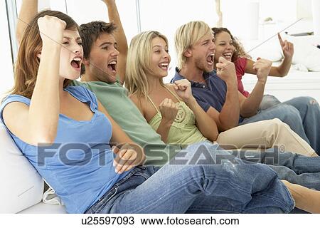 Stock Image - Friends Watching A Game On Television. Fotosearch